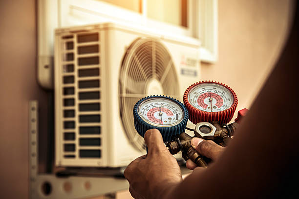 Professional Ac Installation technician working in Ozark, AR